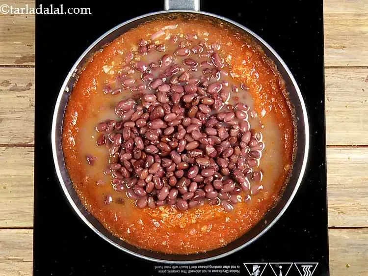 Step 28 – Add the cooked rajma with the water. This recipe is very similar to refried beans, …