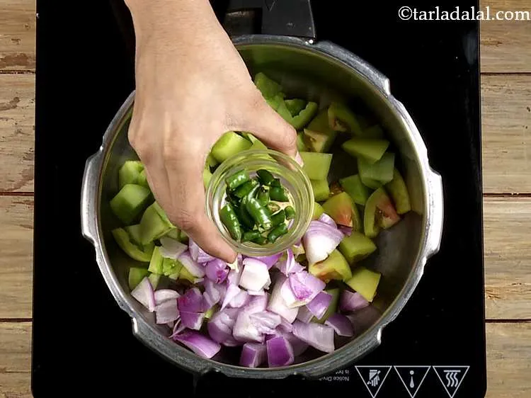 Step 35 – Now add the green chillies for spice.