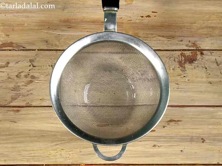 Step 41 – Take a deep bowl and place a strainer over it.