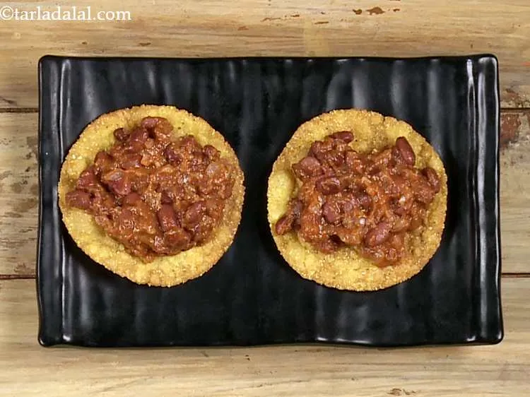 Step 49 – Place a portion of the rajma topping evenly over it.