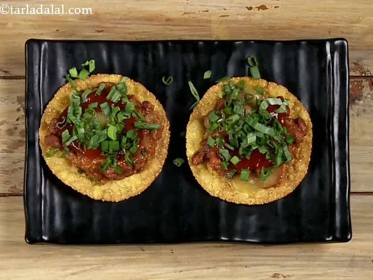 Step 52 – &nbsp;Also sprinkle &frac12; tbsp of spring onion greens over the tomato chilli sauce.