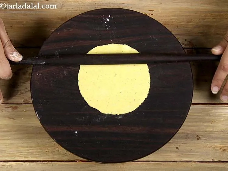 Step 9 – Roll the portion into a 75 mm. (3&rdquo;) diameter thin circle using a little plain …