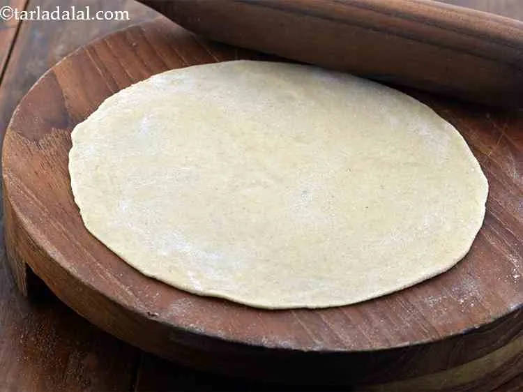 Step 13 – Using more flour for rolling, roll out the dough into a very thin 175 mm. …