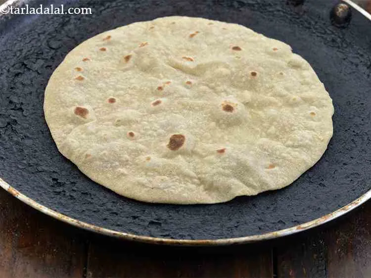 Step 15 – Cook it lightly on the tava for a few seconds. Flip it over and cook …