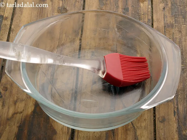 Step 16 – To prepare <strong>eggless chocolate sponge cake in a microwave</strong>, grease a 125 mm. (5&quot;) diameter …