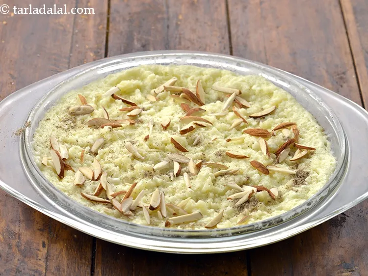 Step 15 – Also sprinkle 2 tbsp&nbsp;<a href="https://www.tarladalal.com/glossary-almond-slivers-slivered-almonds-664i">almond (badam) slivers</a> evenly over it and keep aside to cool …