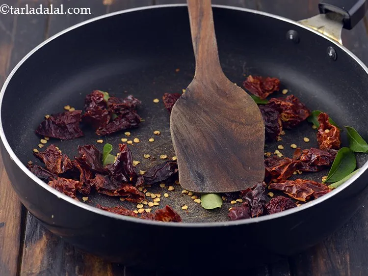 Step 12 – Add the curry leaves to it and dry roast on a medium flame for 1 …