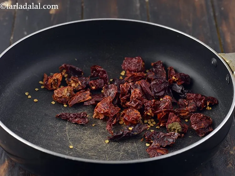 Step 10 – Add red chillies in the same pan. We have made use of Kashmiri red chillies, …