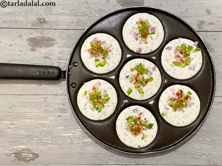 Step 43 – Sprinkle a little chilli powder over each uttapa. This is optional as some don&#39;t like …