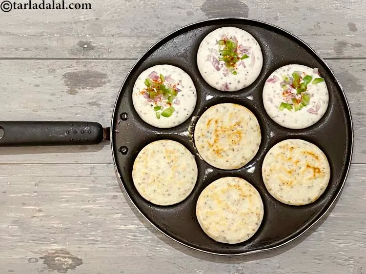 Step 44 – Cook all the uttapas, using 1 tsp of oil, till they turn golden brown in …