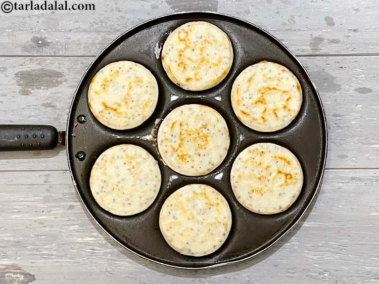 Step 45 – Now flip all the <strong>bajra urad dal uttapams | rice&nbsp;bajra urad dal uttapam |</strong> over.