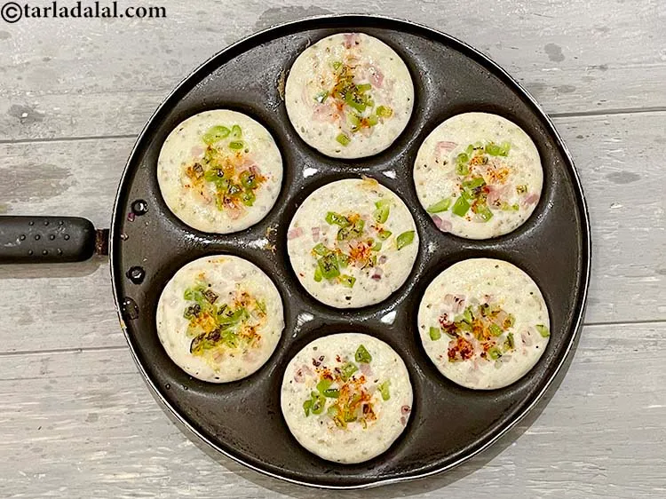 Step 46 – Cook and flip over and your <strong>bajra urad dal uttapams | rice&nbsp;bajra urad dal uttapam …