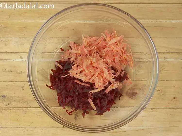 Step 3 – Add the grated carrot. The combination of beetroot and gajar works really well.