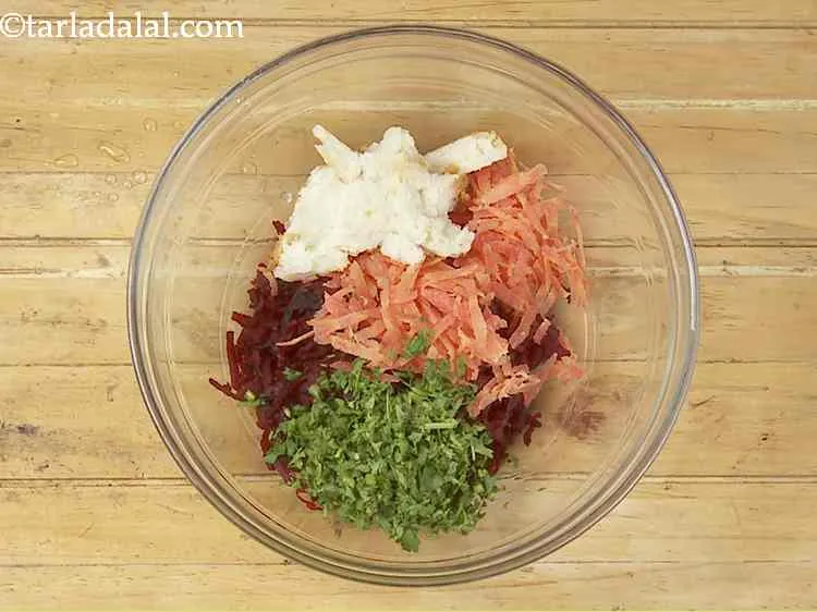 Step 5 – Now, add the coriander. It provides a subtle earthy flavour to the tikki mixture.