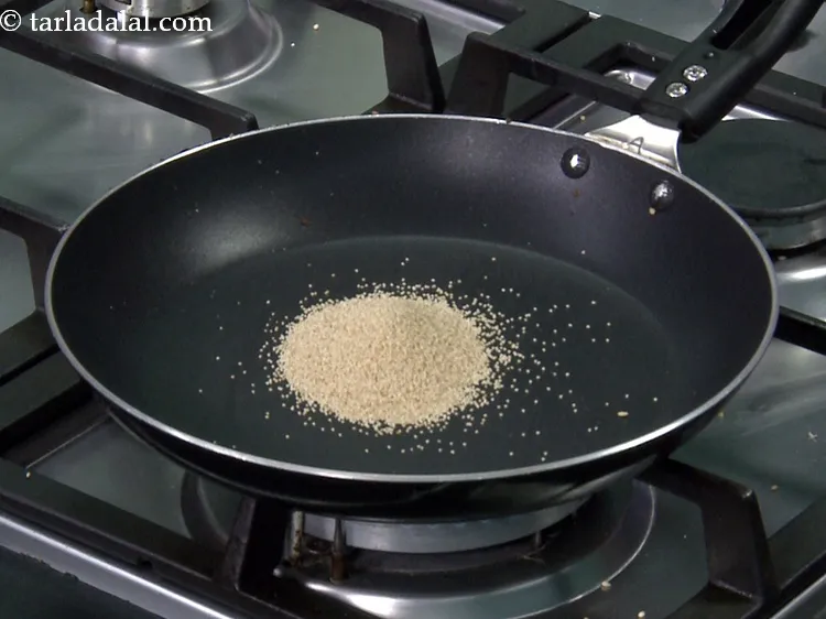 Step 20 – Add 2 tbsp&nbsp;<a href="https://www.tarladalal.com/glossary-poppy-seeds-589i">poppy seeds (khus-khus)</a> into the same pan.