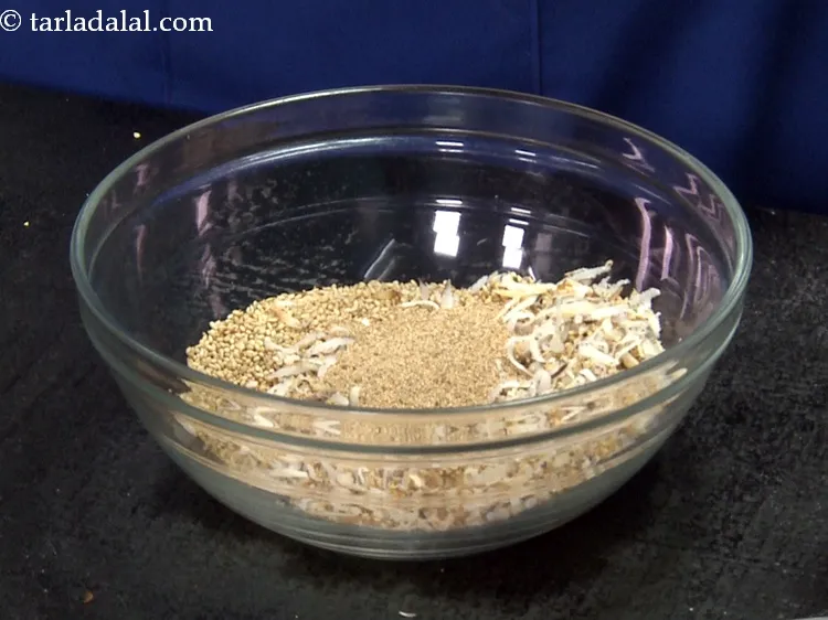 Step 22 – Remove it in the bowl containing roasted dry coconut and sesame seeds. Keep aside to …