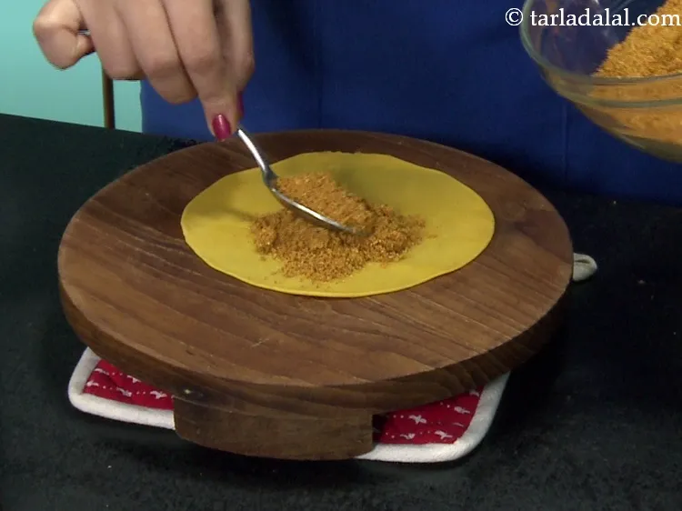 Step 42 – Place a portion of the masala over it. This is about 2 tbsp of masala.&nbsp;