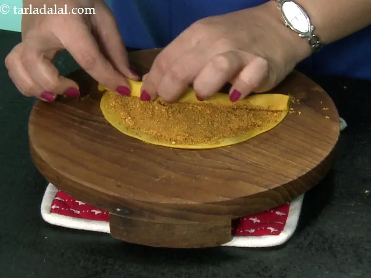 Step 63 – While rolling remember to pinch the masala inwards simultaneously. The rolling has to be tight …