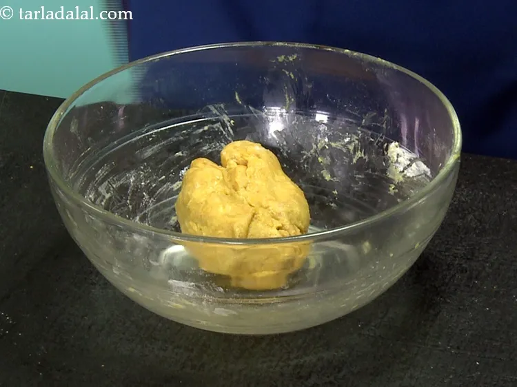 Step 10 – Knead into a semi-stiff dough. The dough might be little sticky as there is besan …