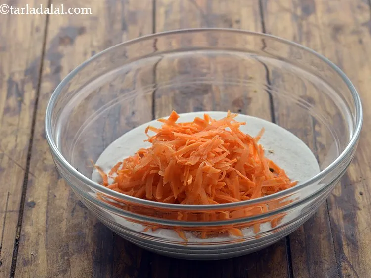 Step 25 – Add 1/4 cup&nbsp;<a href="https://www.tarladalal.com/glossary-grated-carrot-816i">grated carrot</a>.