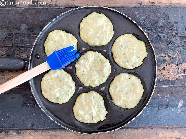 Step 25 – Let the bottom of the pancakes cook for a while. Then grease the uncooked top …