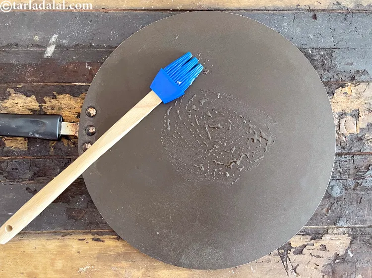 Step 36 – Grease the dosa tava with little oil by using a brush.