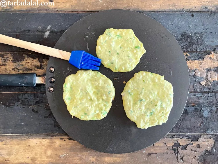 Step 39 – Then grease some oil on the top of the uttapam as we are going to …