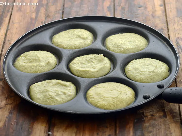 Step 20 – Pour a spoonful of the batter in each uttapa mould to make a 75 mm. …