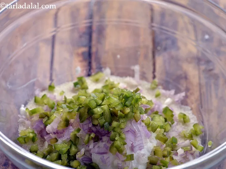 Step 5 – Add finely chopped capsicum. To make the&nbsp;<strong>Mini Rava Vegetable Pankcake</strong>&nbsp;colorful, also add bell peppers.