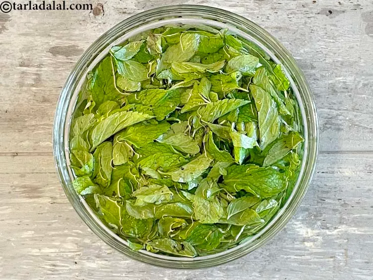 Step 10 – Place the mint leaves in a deep glass bow. Immerse the mint leaves in clean …