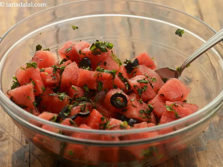 Step 21 – Toss all the ingredients of <strong>mint watermelon salad</strong> using a big spoon.