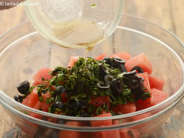 Step 20 – Finally add the <strong>lime honey dressing of healthy watermelon mint salad</strong> also.