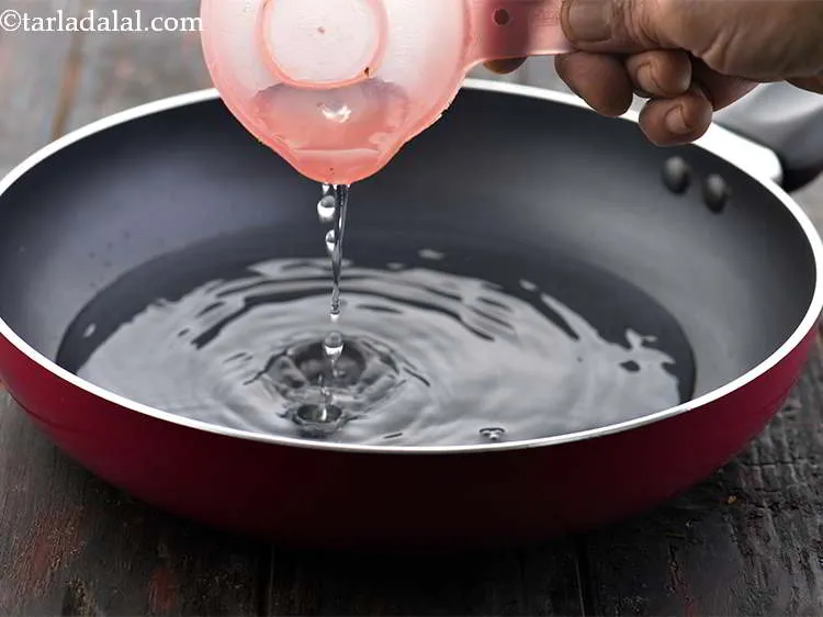 Step 7 – In a deep non-stick pan, take 1/2 cup of water and let it boil.