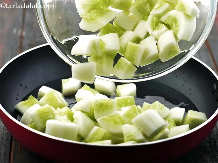 Step 8 – Once you see small bubbles showing up in the water, add the chopped cucumber to …