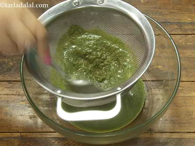 Step 15 – Pour the prepared minty jaljeera and strain the mixture very well using a strainer. Discard …