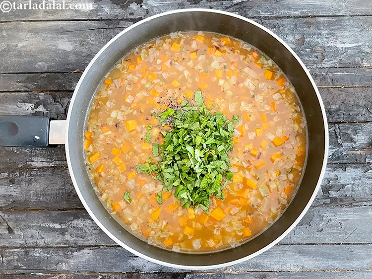 Step 29 – Add&nbsp;<meta charset="UTF-8" />1/4 cup&nbsp;finely&nbsp;<a href="glossary-chopped-mint-788i">chopped mint leaves (phudina)</a>.