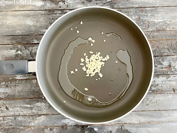 Step 14 – Add&nbsp;<meta charset="UTF-8" />2 tsp&nbsp;finely&nbsp;<a href="glossary-chopped-garlic-790i">chopped garlic (lehsun)</a>.