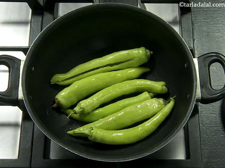 Step 20 – Heat the oil in a deep non-stick pan, add the chillies and shallow fry them …