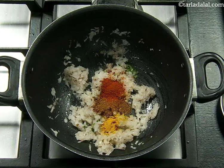 Step 26 – Add the chilli powder and turmeric powder.