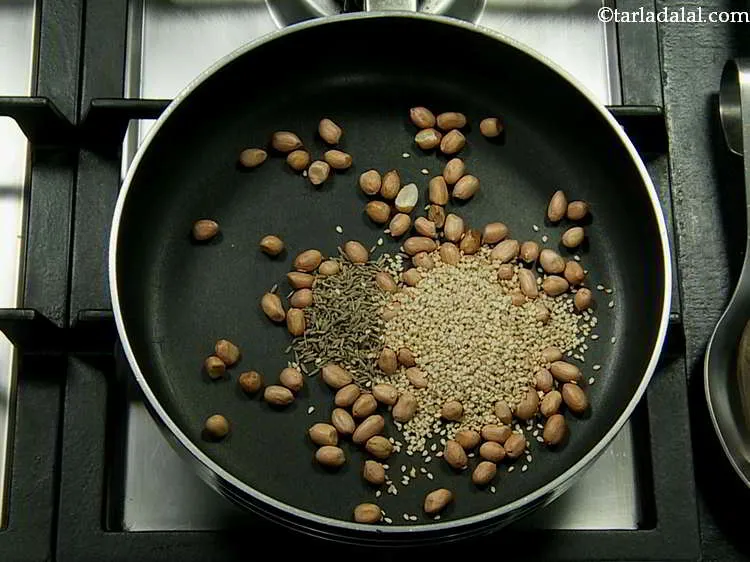 Step 8 – Add cumin seeds and sesame seeds.