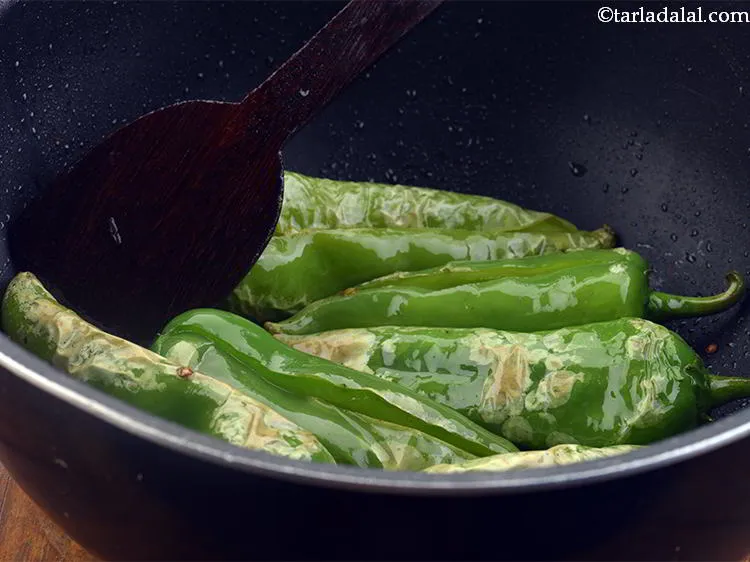 Step 21 – Shallow fry the chillies till light brown from both the sides.