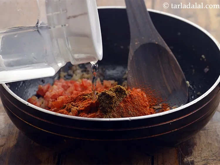 Step 26 – Add 1 tbsp of water. This will prevent the masalas from burning and sticking to …