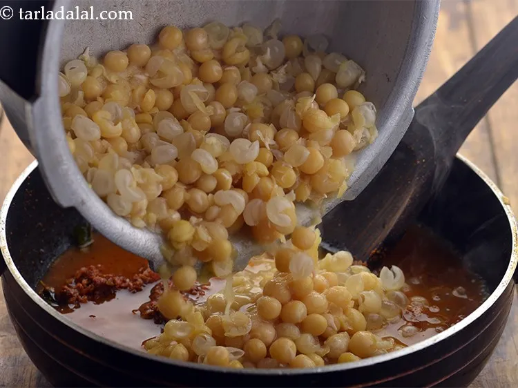 Step 28 – Add the cooked safed vatana with its water.