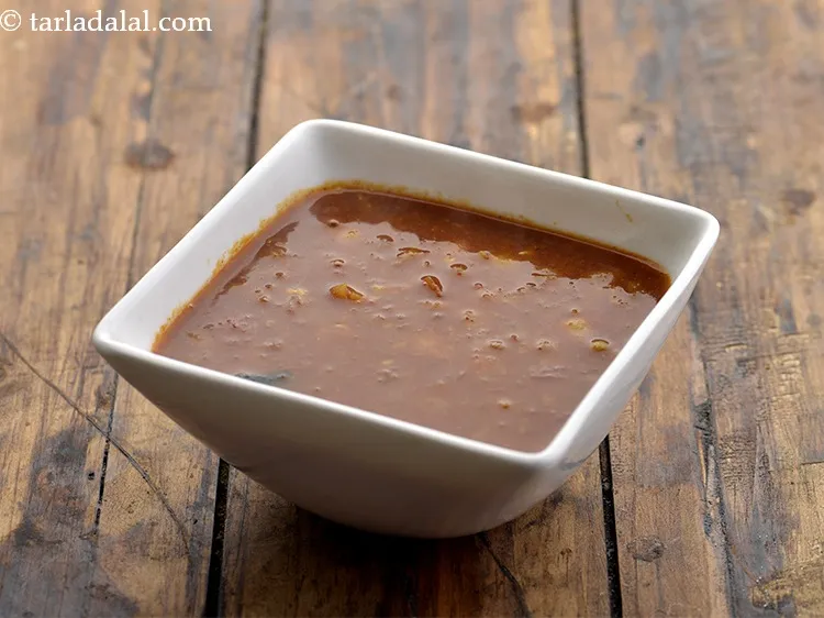 Step 31 – Just before serving the <strong>misal pav</strong>, pour &frac14; of the <strong>misal</strong> in a serving bowl.