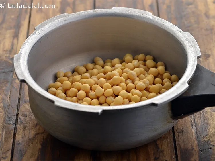 Step 5 – Put the soaked and drained peas in a pressure cooker.