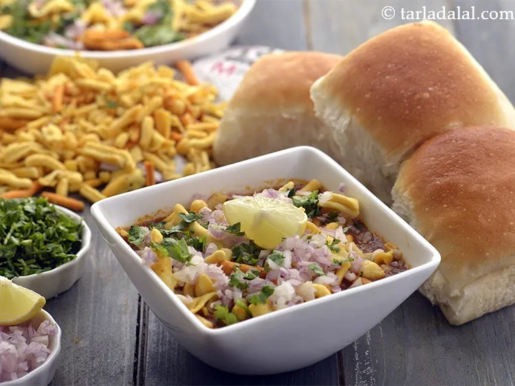 Step 36 – Serve <strong>misal</strong> immediately with ladi pavs and lemon wedges. I usually <a href="https://www.tarladalal.com/Whole-Wheat-Ladi-Pav-Eggless-Homemade-Laddi-Pav-Buns-41387r" target="_blank">make whole …