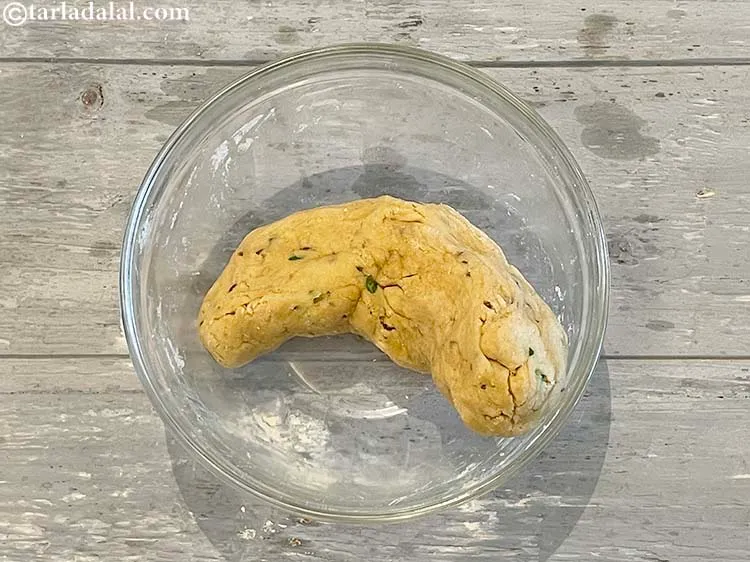 Step 13 – Roll the dough into a cylinderical shape as its easy to make 10 balls out …