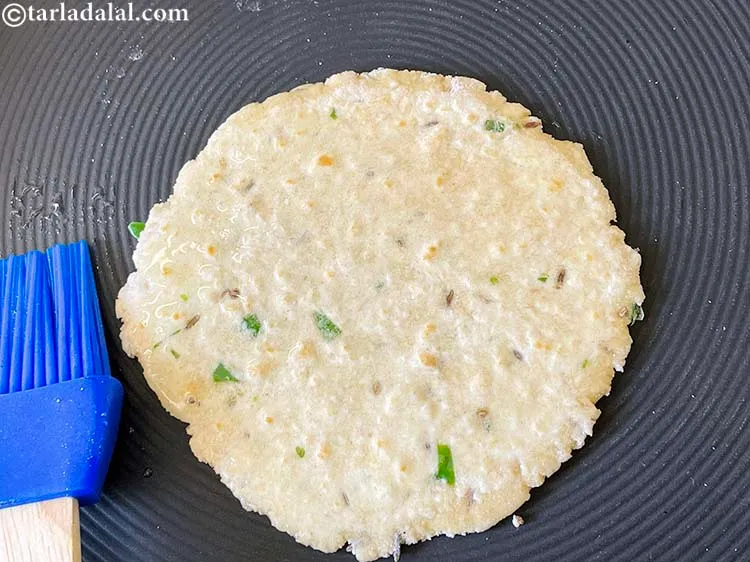 Step 18 – Apply a little ghee on the roti and allow it to cook.
