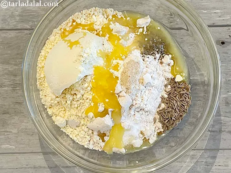 Step 8 – Add 4 tsp&nbsp;melted&nbsp;<a href="https://www.tarladalal.com/glossary-ghee-245i">ghee</a>.