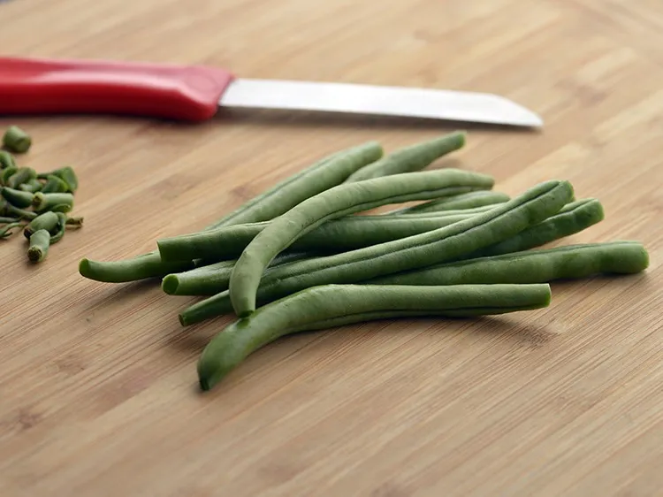 Step 17 – <div> Chop the pointed edges from both the ends of each bean using a sterilized …